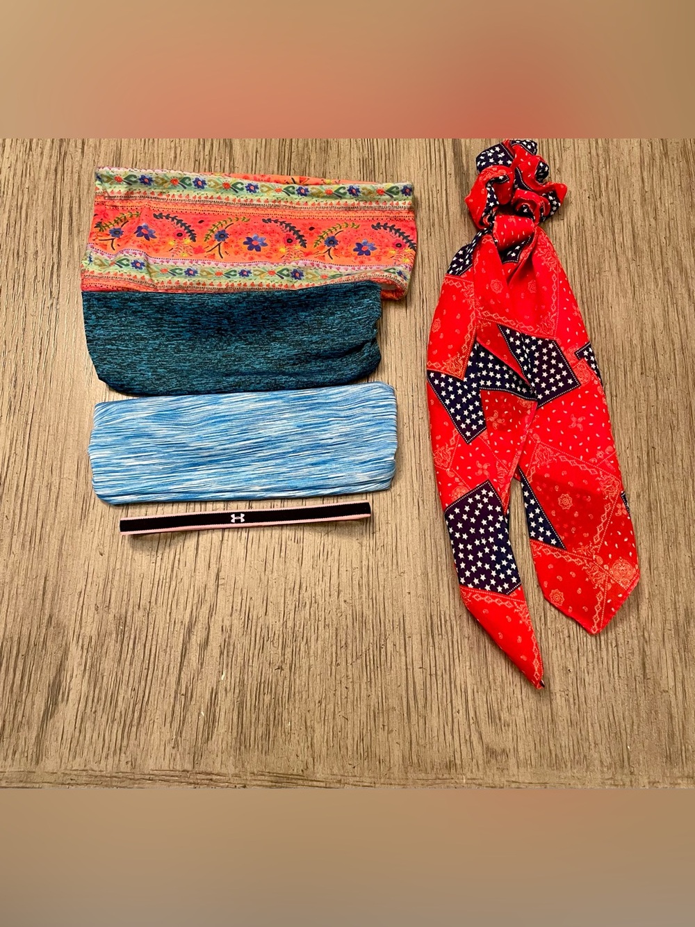 Assorted hair accessories, 4 headbands, one scarf/ponytail holder.